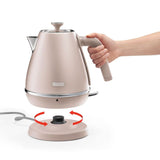 Stylish De'Longhi Distinta Perla Kettle in iridescent pink with 1.7L capacity and 360-degree swivel base for easy use.