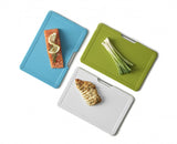 Joseph Joseph Folio Slim 3pc Board Set featuring innovative folding design, textured surface, and soft-grip handle for easy food prep.