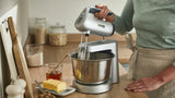 Kenwood Chefette Stand & Hand Mixer in silver with 650W motor, featuring variable speeds, splashguard, and efficient storage.