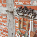 Elegant wall hanging featuring a charming row of birds in a gift box, perfect for home decor or thoughtful gifting.