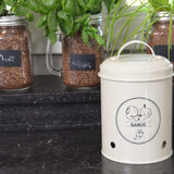 Stylish 17.2cm garlic storage tin with ventilation holes, keeps garlic fresh, and complements any kitchen decor.