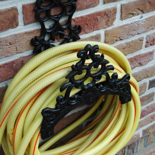 Antique Classic Hose Holder in cast iron, featuring a decorative design for secure hose storage and vintage garden charm.