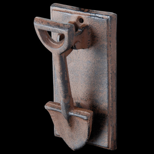 Vintage cast iron doorknocker shaped like a spade, handcrafted for a stylish and welcoming home entrance.