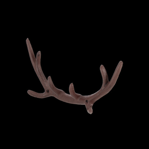 Cast iron antler hook for wall decor and practical use, combining rustic charm and functionality in any space.