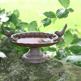 Decorative bird bath with two perched birds, 23 x 14 x 13cm, providing a safe elevated water source for garden birds.