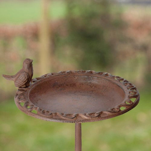 Decorative bird bath on a pole, 39cm high, features split bowl for water and feed, perfect for attracting birds to your garden.