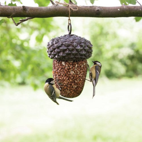 Acorn-shaped bird feeder made of PVC and iron, designed for easy filling and attracting various birds to your garden.