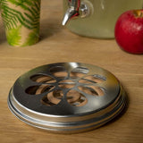Citronella coils in a zinc burner with metal holder, repelling insects naturally for outdoor enjoyment, 14 x 14 x 3cm.