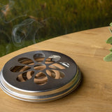 Citronella coils and zinc burner set for outdoor insect repellent, featuring 10 coils with 6-12 hours burn time, 14x14x3cm.