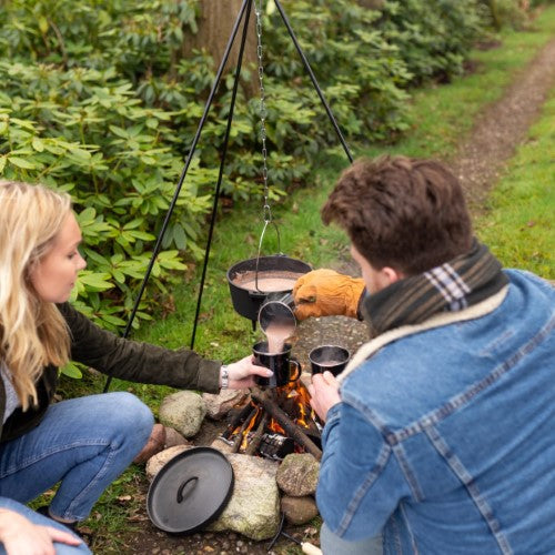 Stylish enamel mug with vintage charm, perfect for hot drinks during camping and outdoor adventures.