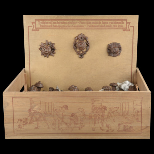 Set of 6 assorted cast iron doorknobs in a wooden display box, perfect for enhancing home décor with rustic charm.