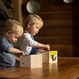 DIY wooden birdhouse kit with three paint colors, designed for small birds; features easy access opening and dimensions 14 x 11 x 20cm.