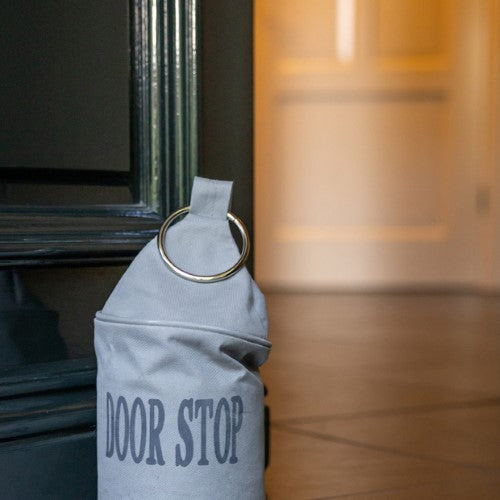 Set of 4 stylish black/grey doorstop bags with a metal ring, measuring 28cm, designed to prevent door slams.