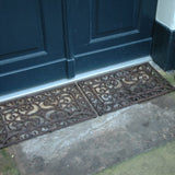 Cast iron doormat (34 x 58cm) with Victorian curls, combining elegance and durability for any entrance.