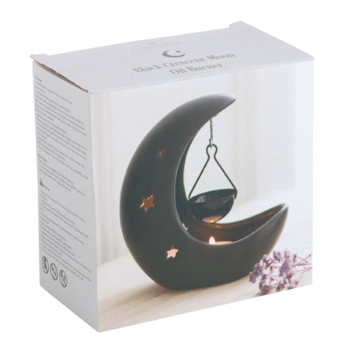 Black crescent moon hanging oil burner with star cut-outs, perfect for creating a magical atmosphere and filling spaces with fragrance.