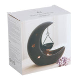 Black crescent moon hanging oil burner with star cut-outs, perfect for creating a magical atmosphere and filling spaces with fragrance.