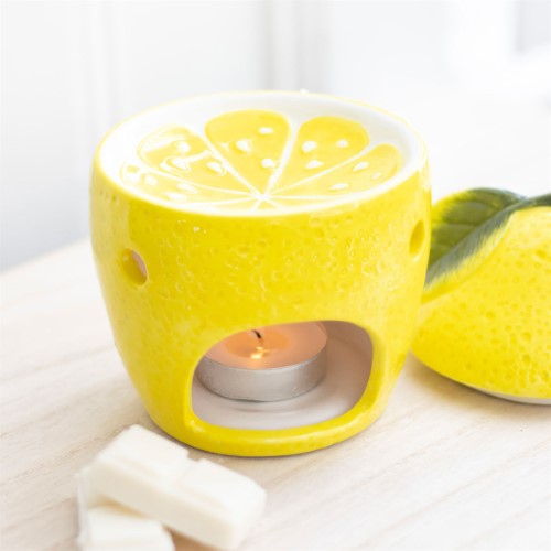 Cheerful yellow lemon oil burner, perfect for diffusing scents and enhancing home decor with a whimsical touch.