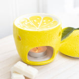 Cheerful yellow lemon oil burner, perfect for diffusing scents and enhancing home decor with a whimsical touch.