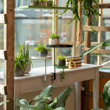 Large windowsill clamp tray with adjustable height, perfect for plants or decor, in assorted designs. Ideal for enhancing space.