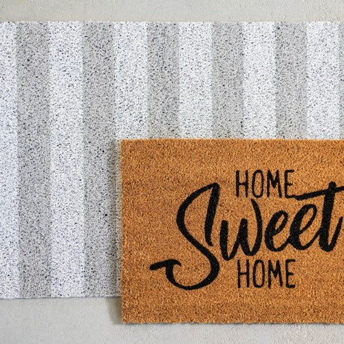 Stylish striped anti-slip doormat (90x60cm) for indoor/outdoor use, capturing dirt and moisture while enhancing entryway aesthetics.