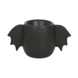 Black bat wing egg cup designed for serving soft-boiled eggs, adding a whimsical gothic touch to breakfast.