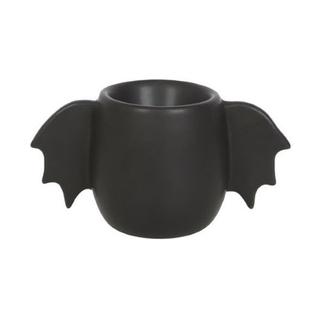 Black bat wing egg cup designed for serving soft-boiled eggs, adding a whimsical gothic touch to breakfast.