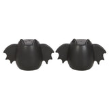 Whimsical bat wing salt and pepper shakers, adding gothic flair to dining with a unique design for every occasion.