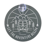 Cheerful campervan window sign with "Let the adventure begin" text, perfect for home or vehicle decor.