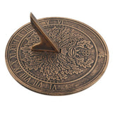 Green Man terracotta sundial by Lisa Parker, featuring a rustic bronze finish, ideal for garden decor and timekeeping.