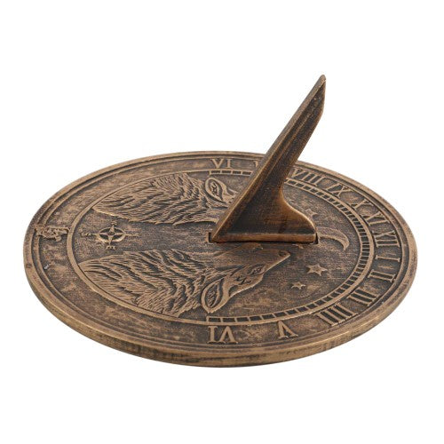 Howling Wolves Terracotta Sundial featuring a rustic bronze finish, perfect for outdoor decor and timekeeping.
