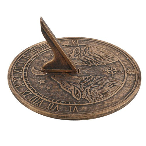 Howling Wolves Terracotta Sundial by Lisa Parker featuring a bronze-like finish and intricate wolf design, perfect for outdoor decor.