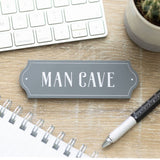 Vintage 'Man Cave Wall Plaque' showcasing masculinity, perfect for dad’s retreat, measuring H:4 x W:12 x D:O.6 cm.