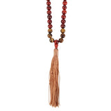 Rosewood and Tiger's Eye mala necklace featuring 108 beads for meditation, self-expression, and spiritual growth, completed with a tassel.