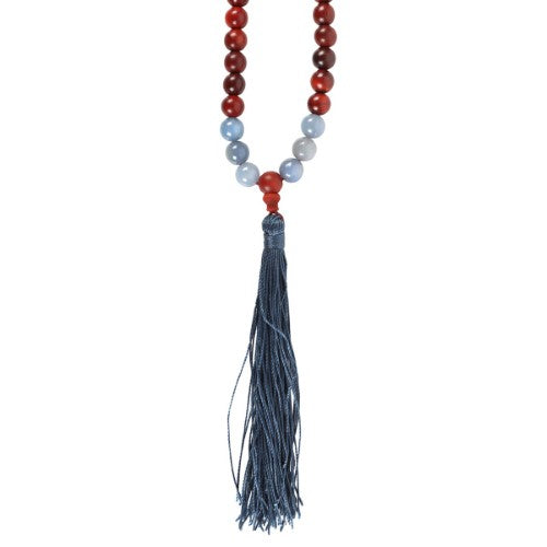 Elegant rosewood and Sodalite mala necklace with 108 beads, promoting communication and mindfulness in spiritual practices.