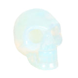 Opalite Crystal Skull in iridescent hues, perfect for meditation or as a stylish desk accessory, measures H:4 x W:5 x D:2 cm.