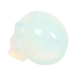 Opalite Crystal Skull in iridescent opalite; a hand-held charm for meditation, healing, and home decor in a black pouch.