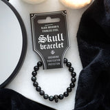 Black Obsidian Skull Bracelet featuring black obsidian beads and a stainless steel skull charm, perfect for style and protection.