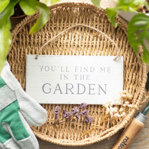 Charming white wash hanging sign reading "You'll Find Me in the Garden," perfect for welcoming guests to your outdoor sanctuary.