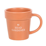 Charming ceramic plant pot mug with mini shovel spoon, featuring "Head Gardener" for tea breaks and gifts for plant lovers.