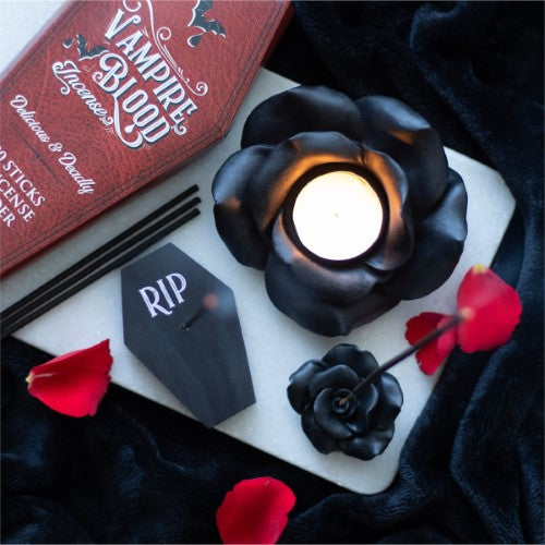 Black Rose Resin Tealight Candle Holder with intricate design, perfect for creating a romantic ambiance in any room.