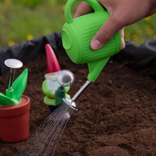 Set of 6 assorted squeeze sprinklers in fun shapes like Gnome and Watering Can, perfect for kids' gardening activities.