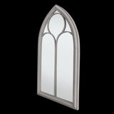 Elegant outdoor mirror styled like a vintage church window, measuring 61 x 112cm, enhances and expands garden spaces.