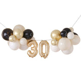 Elegant Champagne Noir balloon bunting decoration for a chic 30th birthday celebration, adding sophistication to any party.