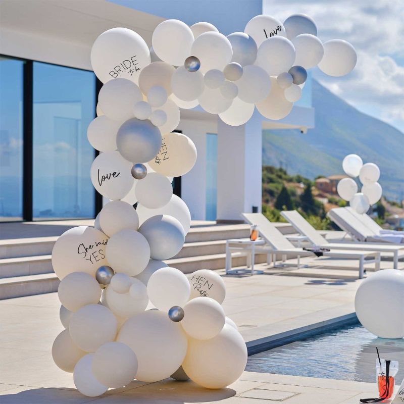 Elegant white and silver balloon arch kit for hen parties, includes 75 balloons for stunning event decor and memorable photos.