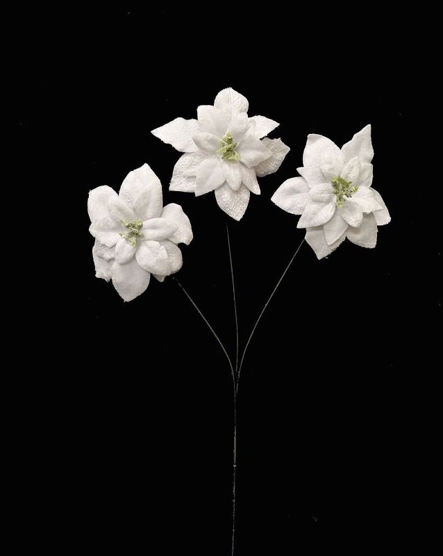 Artificial white velvet poinsettia spray with glitter, perfect for holiday decor and elegant arrangements.