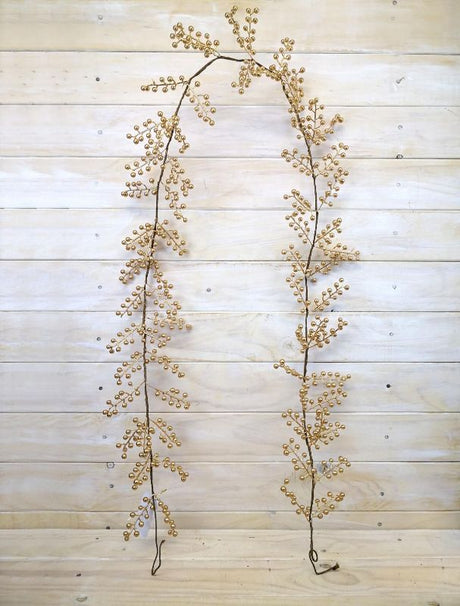 Six-foot artificial berry garland in luxurious gold, perfect for elegant home decor and festive celebrations.