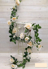 Artificial rose garland with berries in vibrant red, measuring 1.8m, perfect for year-round home decor or events.