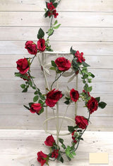 Artificial rose garland with berries, 1.8m in length, featuring realistic details and vibrant red hues for elegant décor.