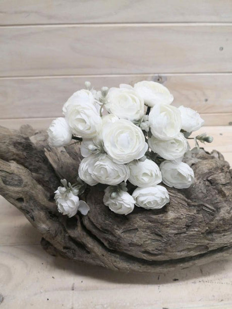 Lifelike white artificial ranunculus posies, perfect for elegant decor, bouquets, and events, offering lasting beauty without upkeep.
