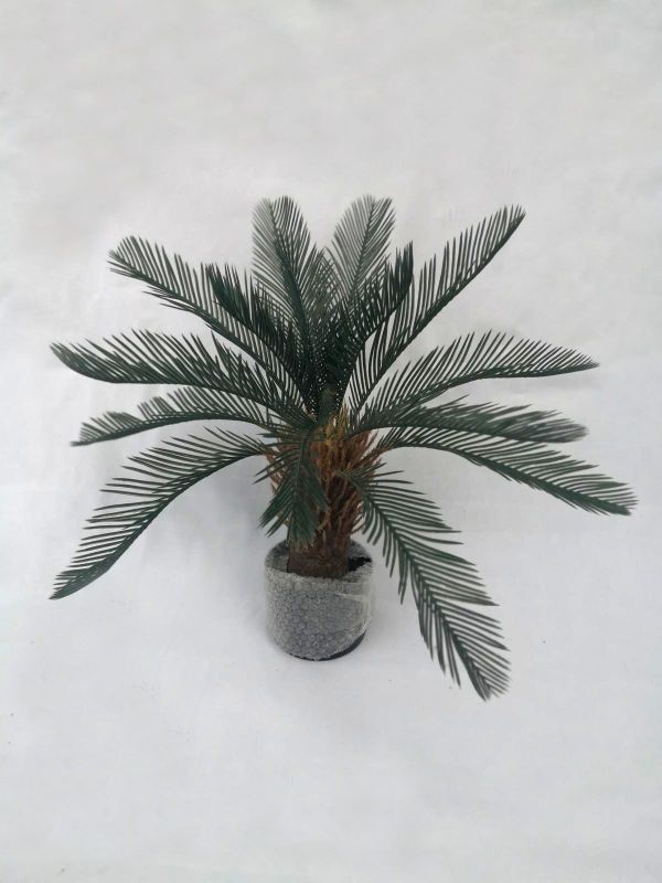 Stylish 0.65m artificial iron tree in pot, perfect for home or office decor with a maintenance-free, realistic design.